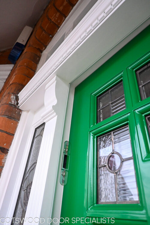 ornamental Edwardian front door with stained glass. A decorative 17 light Edwardian front door with decorative features such as a shelf and dentil block and an apron of which the letterplate is fixed too. The frame is a large frame with sidelights and glazing above the door. The door frame is very ornamental with pilasters (detailed moulding forming columns each side of the door) supporting a decorative transom with detailed mouldings and a dentil block. The stained glass is a art nouveau design featuring roses. door and frame are a replica of the orignal Edwardian joinery. Handmade in Accoya wood and fitted with multipoint locking. Detailed picture of pilaster column